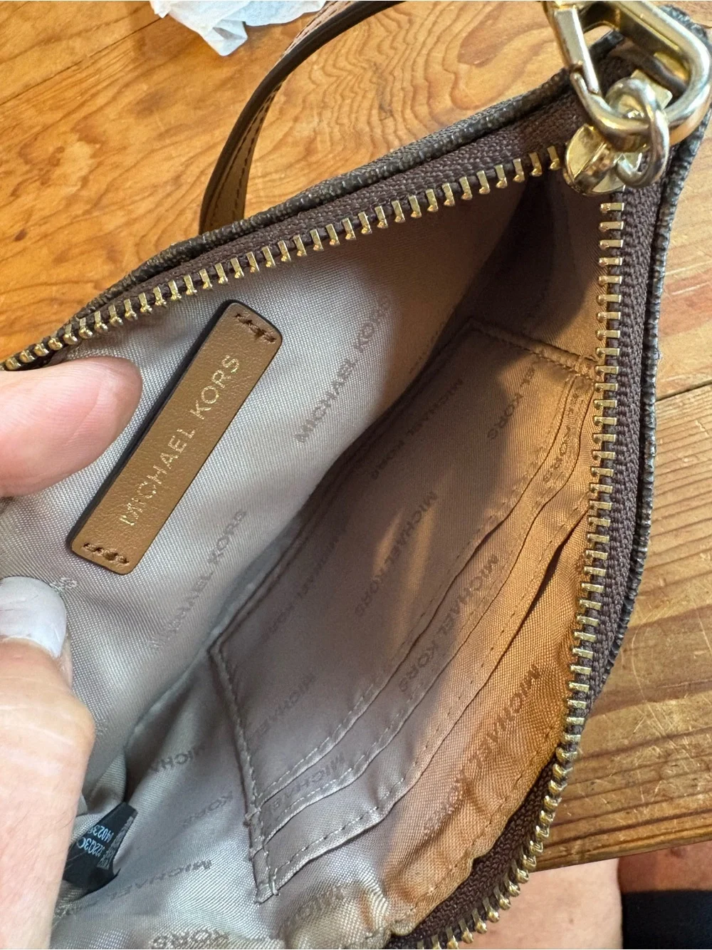 Michael Kors Brown and Tan Signature Wristlet with Gold Plate